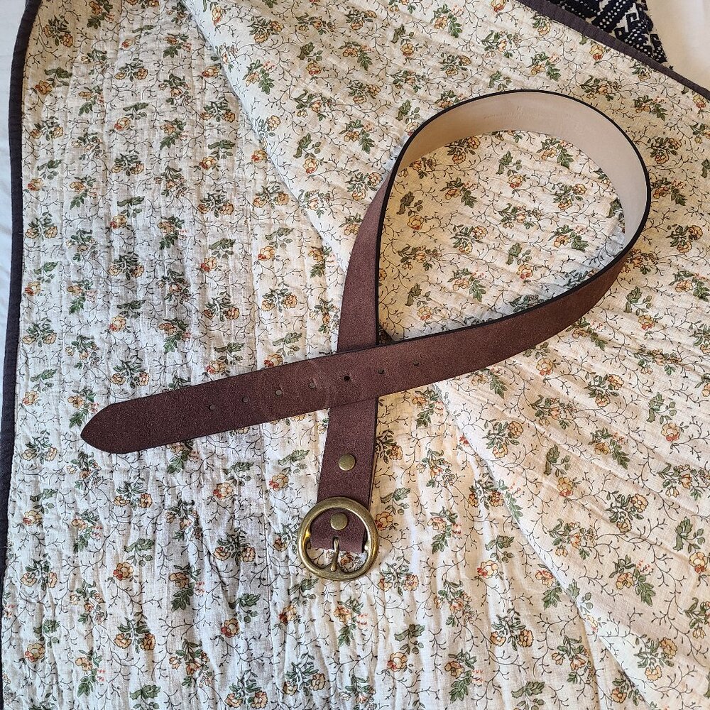 Below the belt brown leather belt
